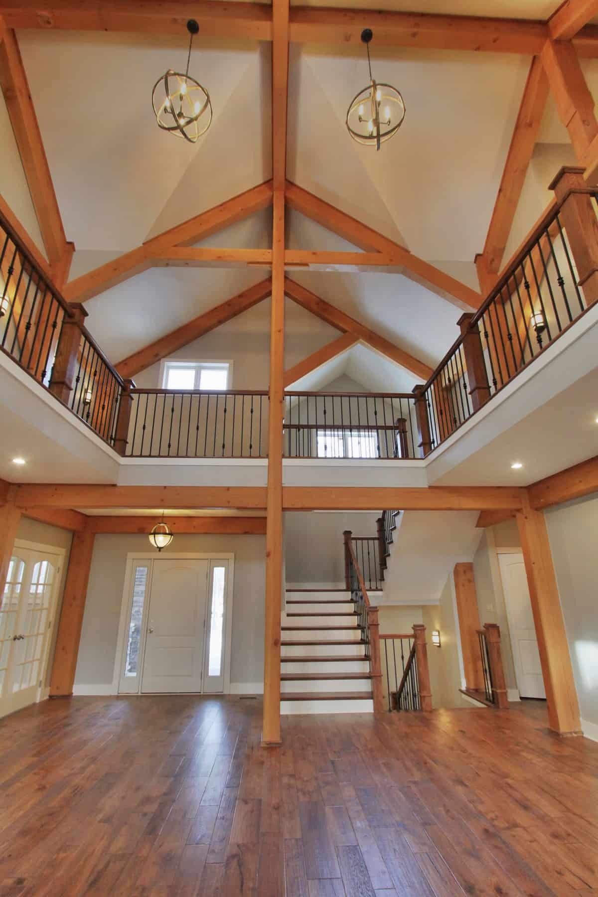 Mountain Timber Estate Timber Frame Great Room and Staircase