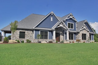 Beautiful blue and stone home exterior