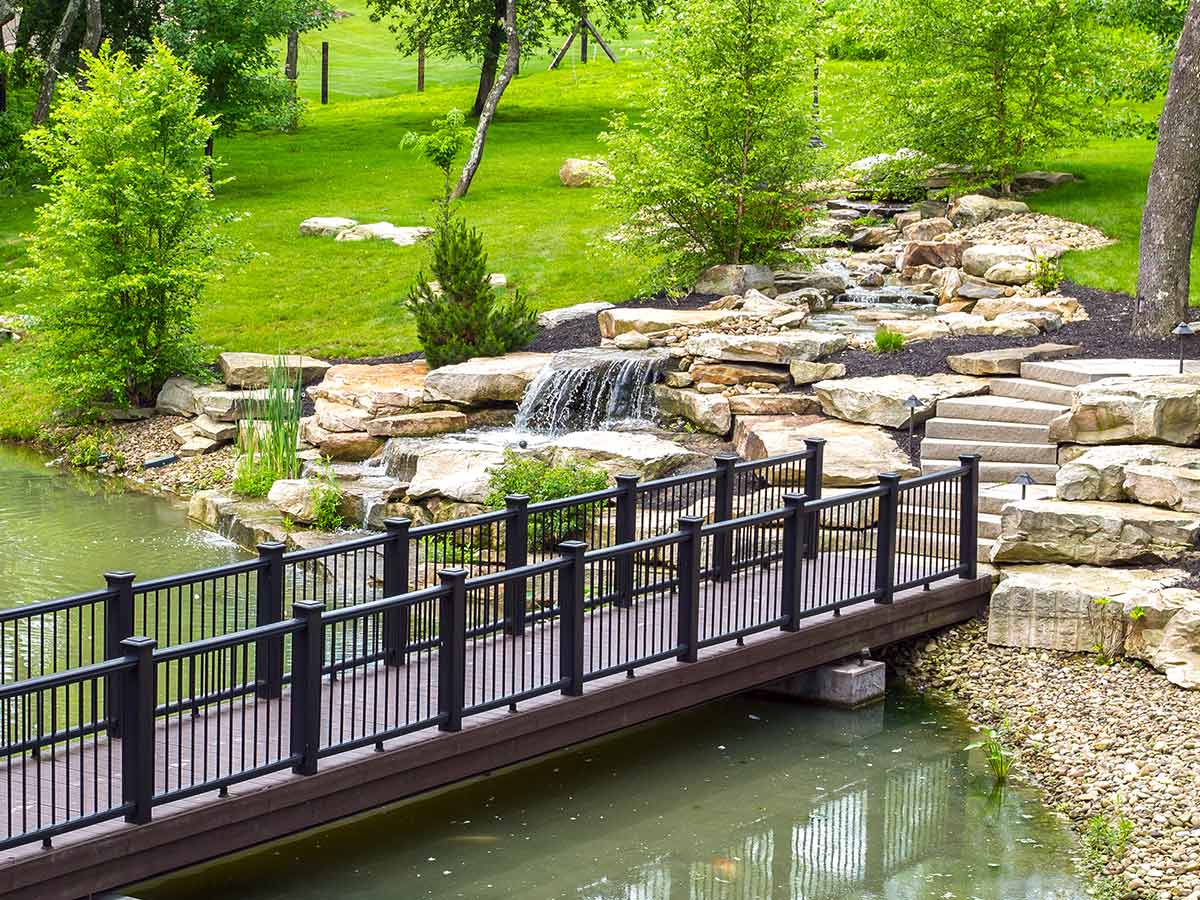 outdoor garden fountain with pond and bridge
