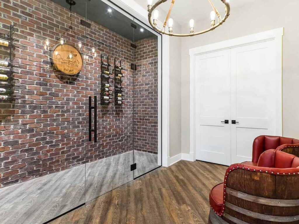wine cellar in luxury home with exposed brick accent